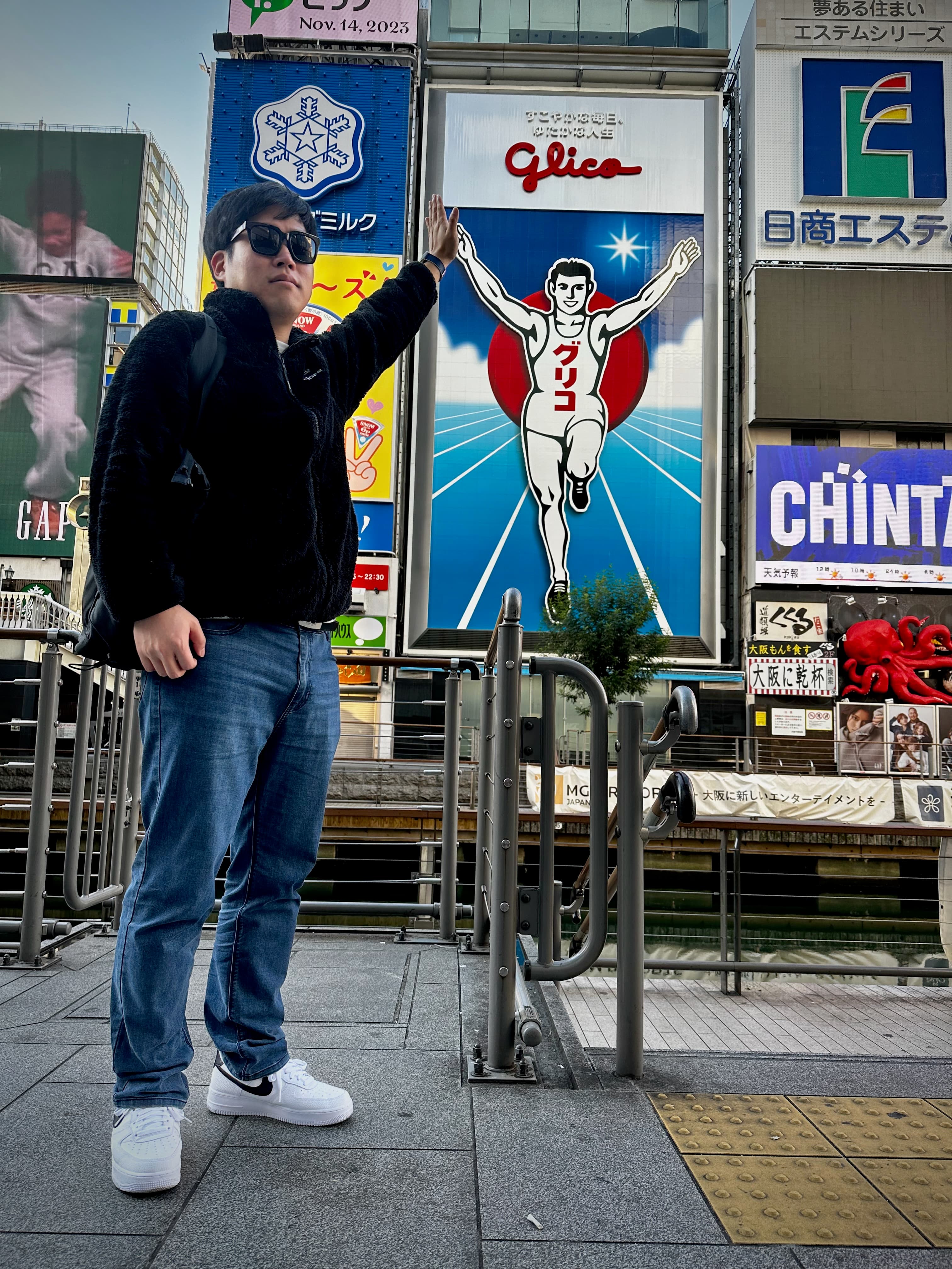 high five with the Glico sign